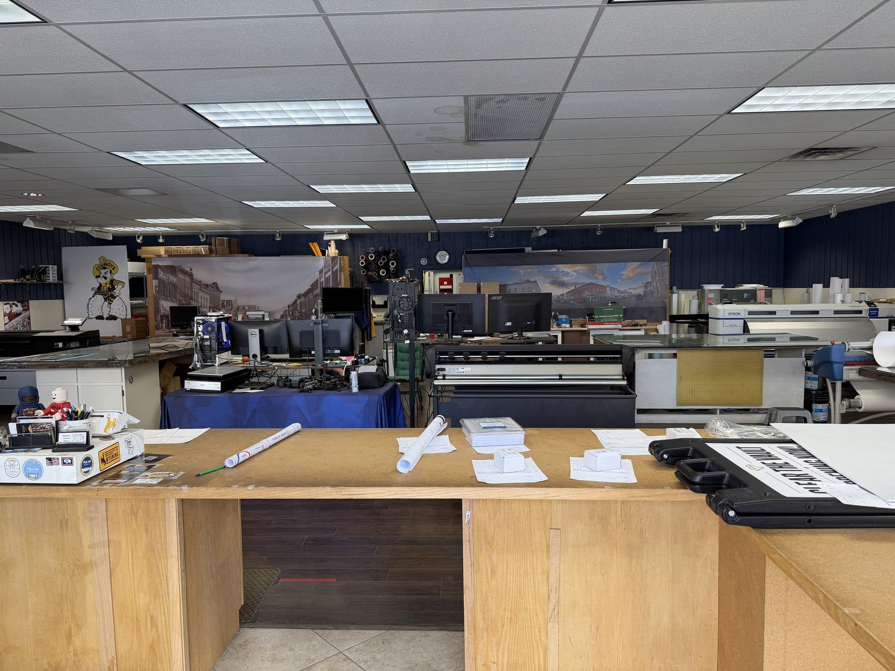 The front counter at digital blues, looking through to the wide-format printers and the shop floor beyond